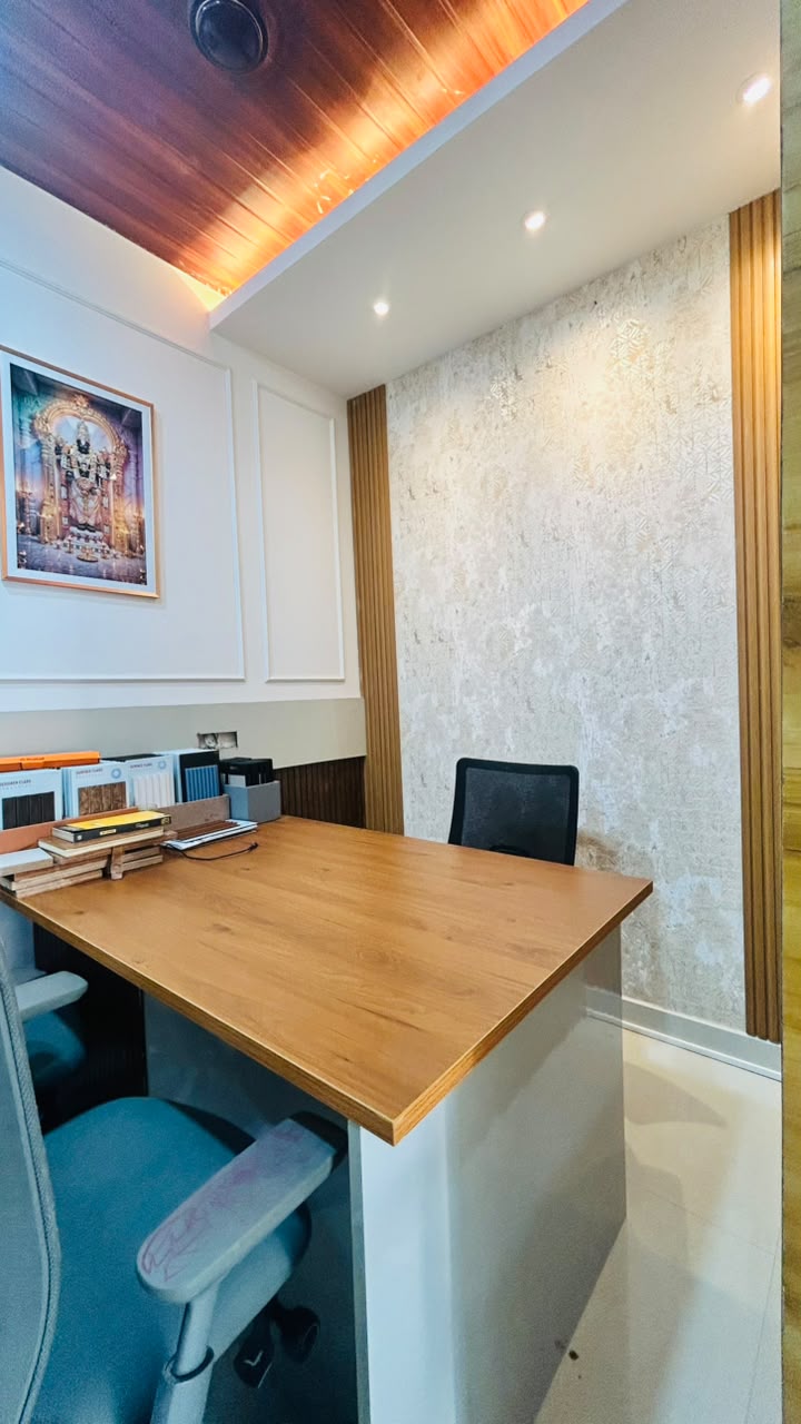 Vasvik Interiors office — consultation desk and textured wall