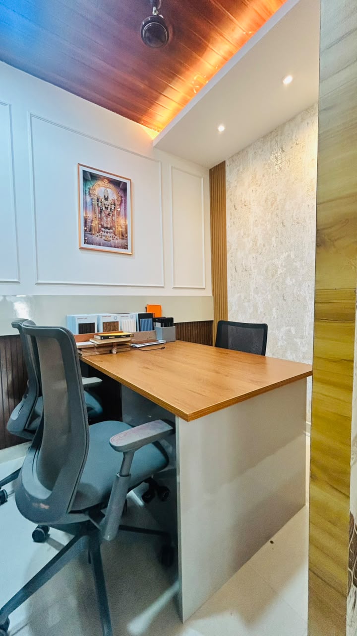 Vasvik Interiors office — client seating at the design desk