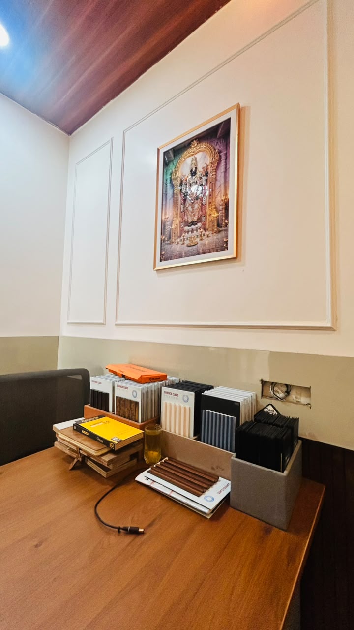 Vasvik Interiors office — sample library under wooden ceiling